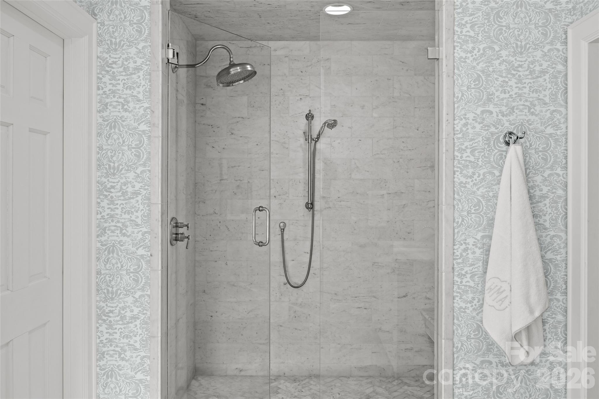 1950 Sterling Road Charlotte, NC 28209 - Photo 28 of 48 a bathroom with a glass shower door