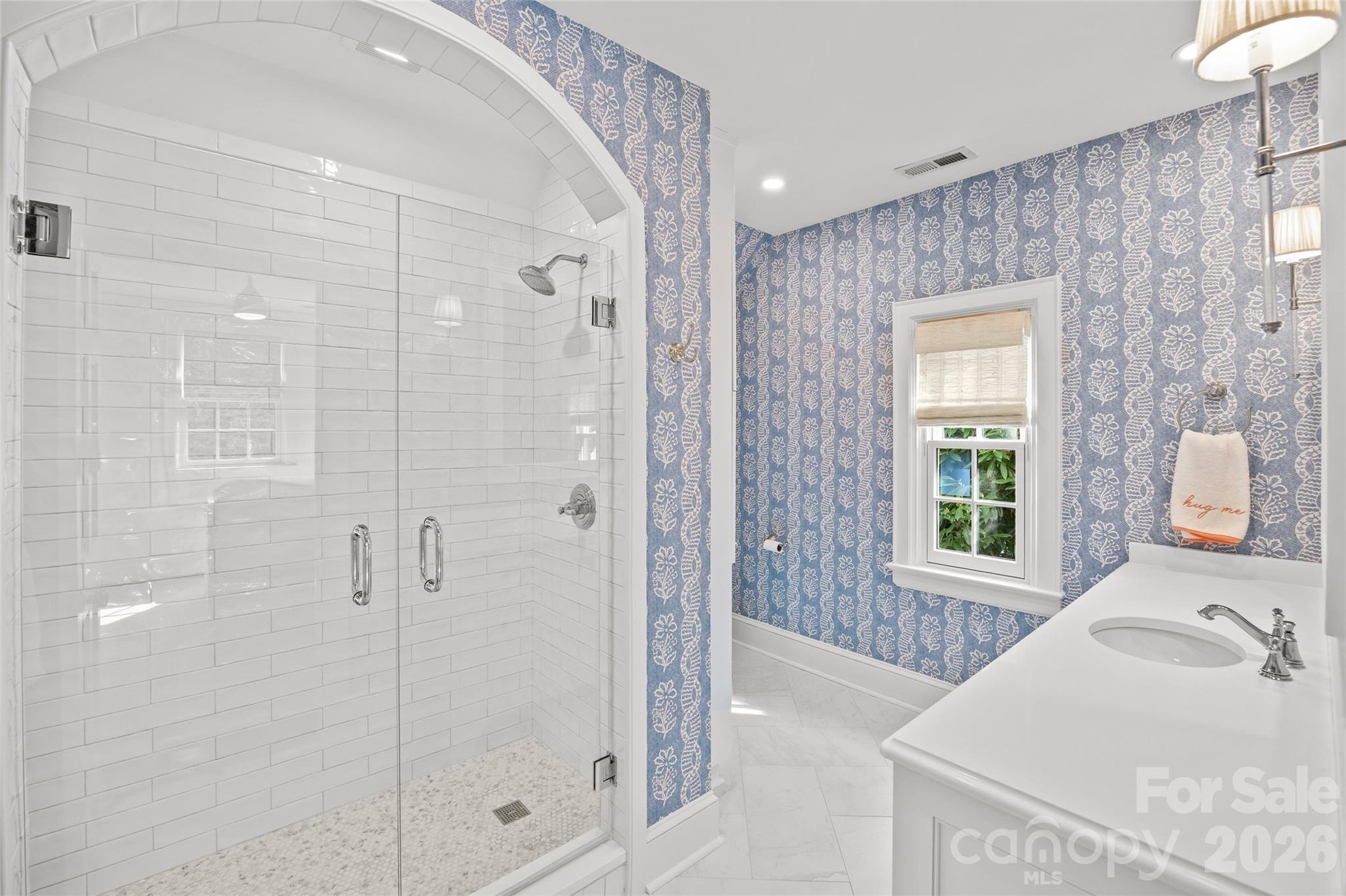1950 Sterling Road Charlotte, NC 28209 - Photo 31 of 48 a bathroom with a granite countertop sink a shower and a mirror