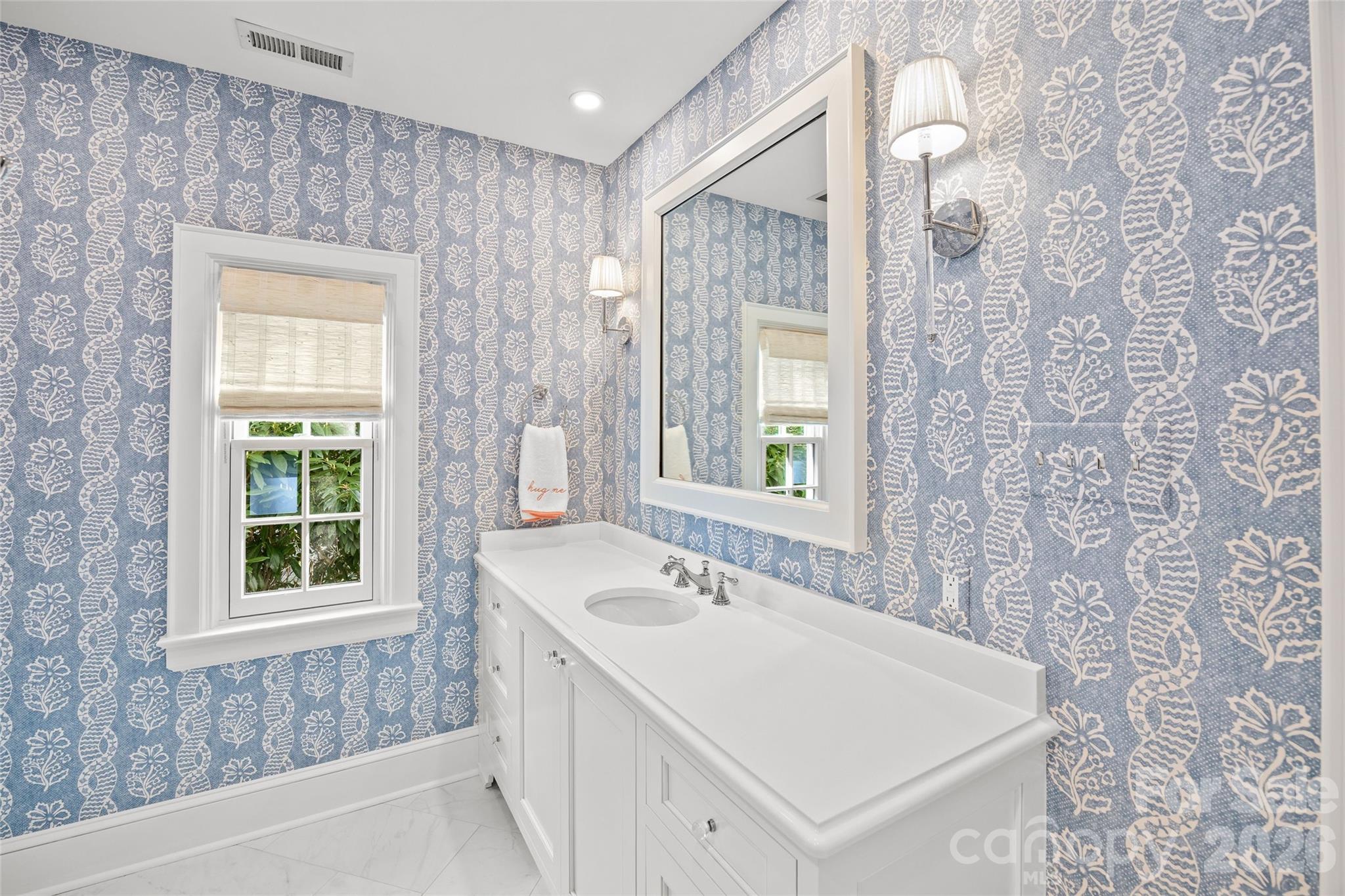 1950 Sterling Road Charlotte, NC 28209 - Photo 32 of 48 a bathroom with a sink a vanity and a bathtub