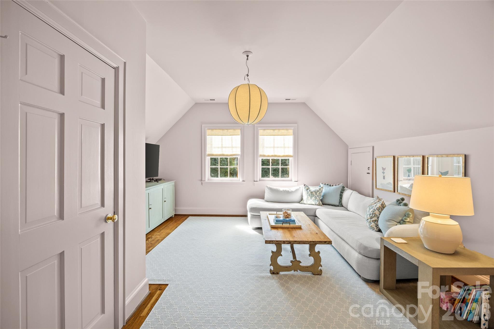 1950 Sterling Road Charlotte, NC 28209 - Photo 33 of 48 a living room with furniture a chandelier and a window