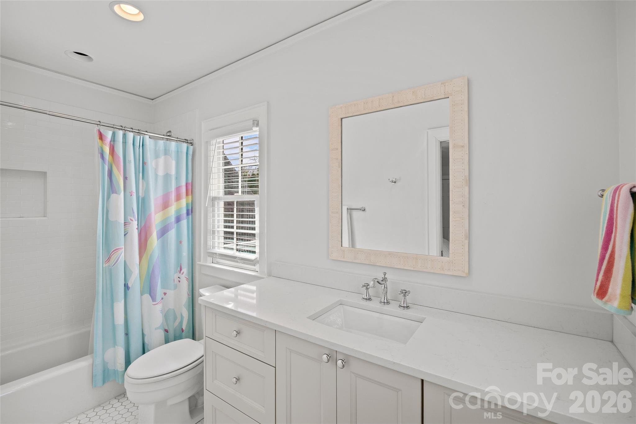 1950 Sterling Road Charlotte, NC 28209 - Photo 38 of 48 a bathroom with a granite countertop sink a toilet and a shower