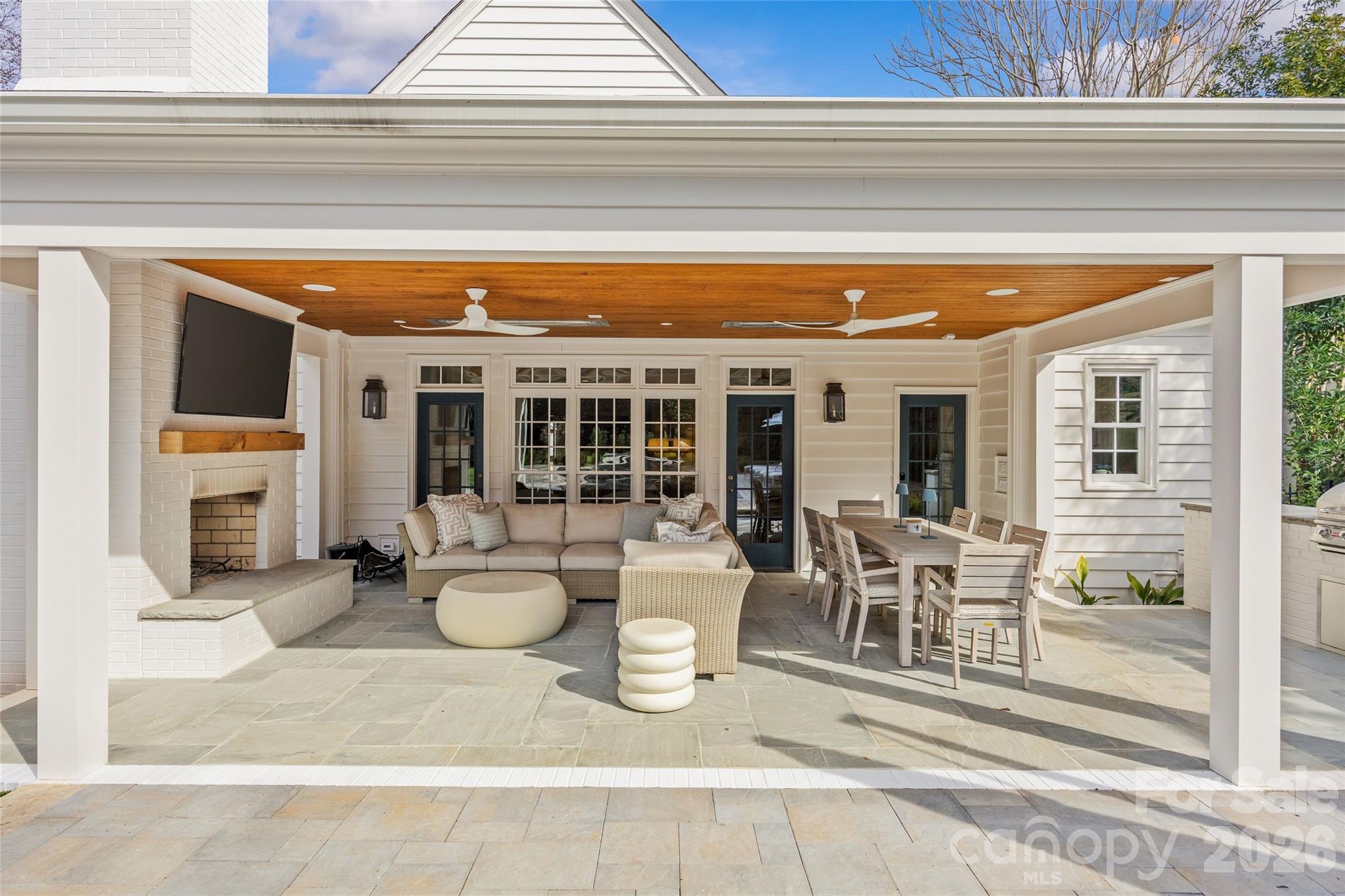 1950 Sterling Road Charlotte, NC 28209 - Photo 39 of 48 a view of a dining room with furniture wooden floor and a fireplace