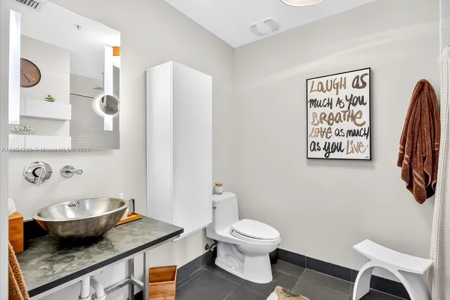 a bathroom with a toilet and a sink