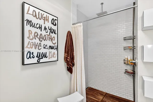 a bathroom with a shower and a toilet