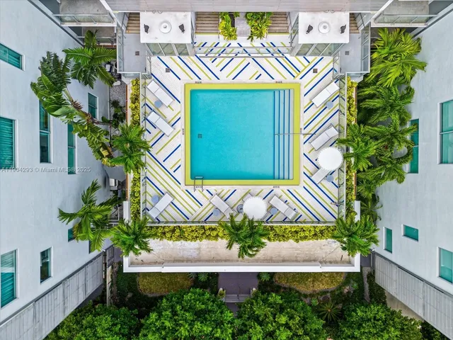 a view of sign board with flower plants