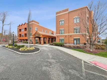 a front view of a building with a yard
