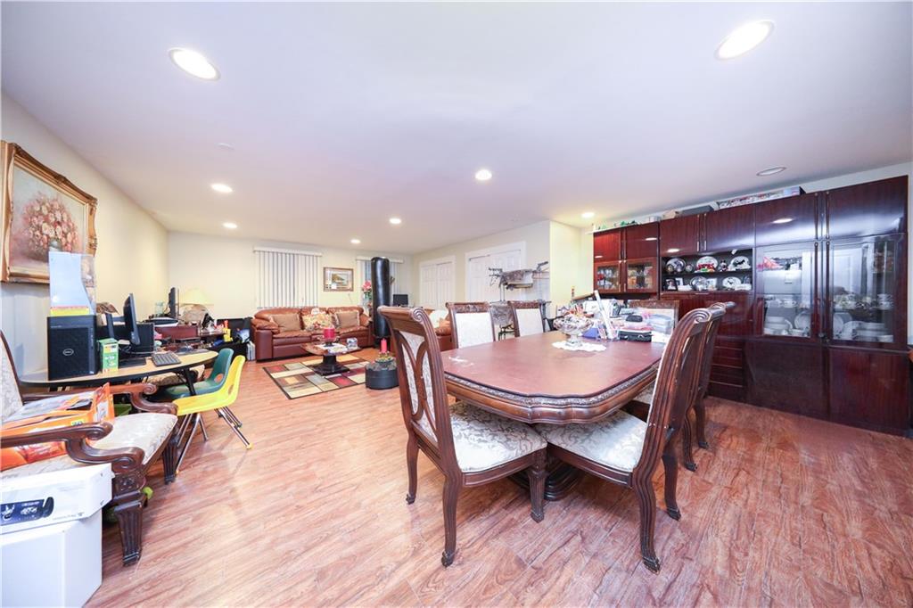 8785 14th Avenue, Unit 1B Brooklyn, NY 11228 - Photo 14 of 29 a view of a dining area with furniture and wooden floor