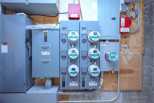 a view of a patio with chairs and potted plants