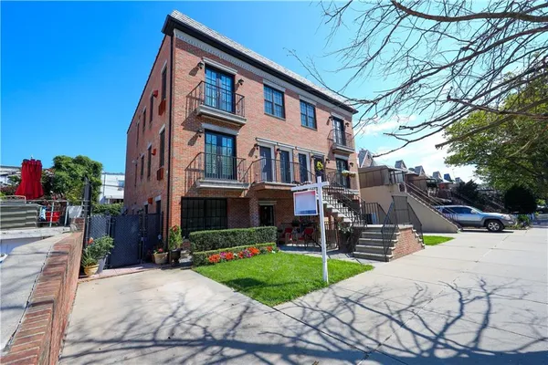 a view of a building with a yard