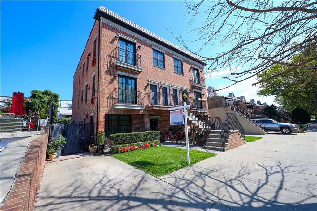 8785 14th Avenue, Unit 1B Brooklyn, NY 11228 - Photo 2 of 29 a view of a building with a yard