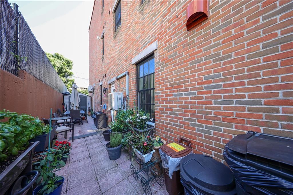8785 14th Avenue, Unit 1B Brooklyn, NY 11228 - Photo 22 of 29 a view of a patio with chairs and potted plants