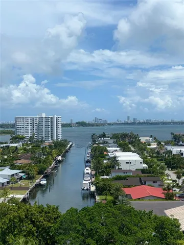 an aerial view of multiple houses with yard