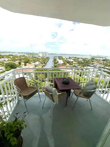 a view of a terrace with couple of chairs