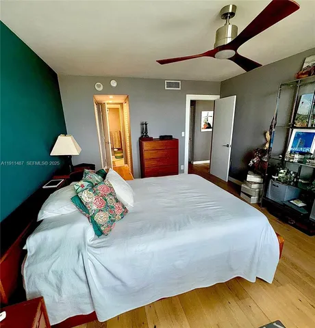 a bedroom with bed and window