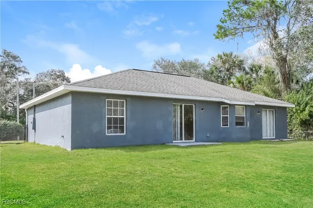 a backyard of a house with lots of green space