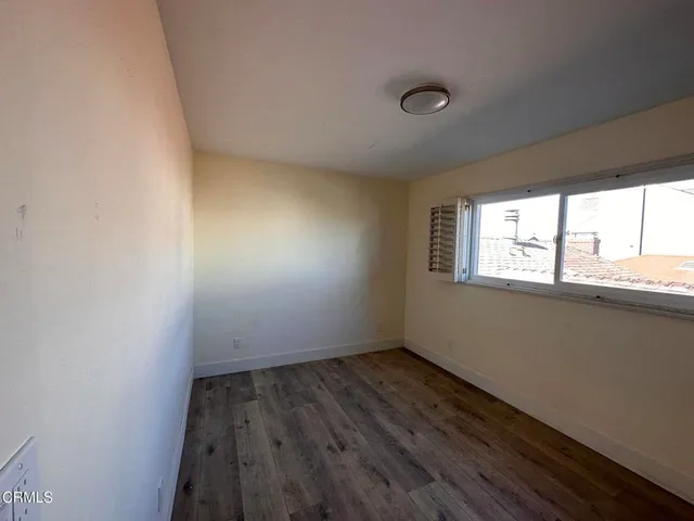 a view of an empty room and window