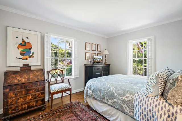 a bedroom with a bed and a couch