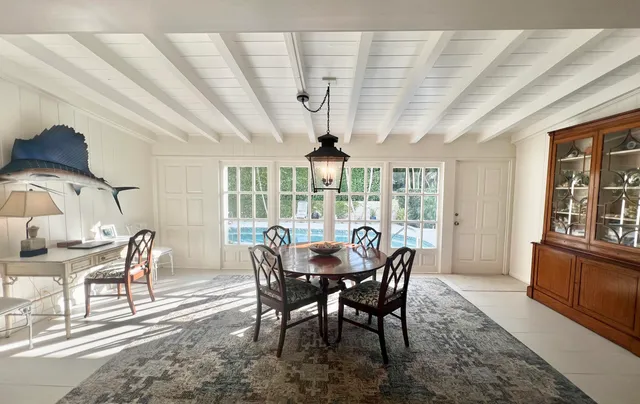 a view of a dining room with furniture window and outside view