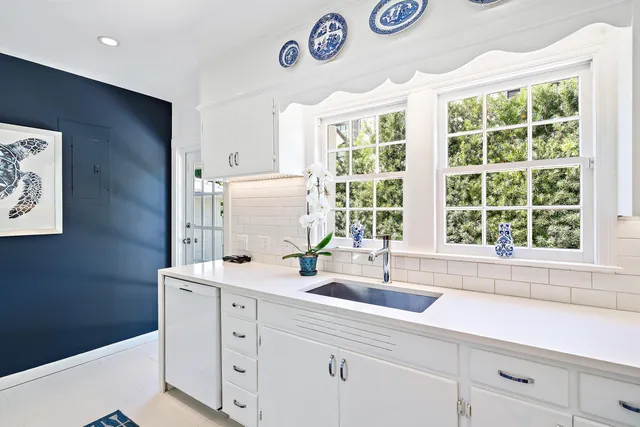 a kitchen with a sink and a window