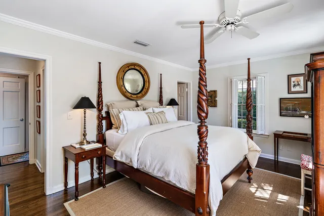 a bed room with a bed and a chandelier