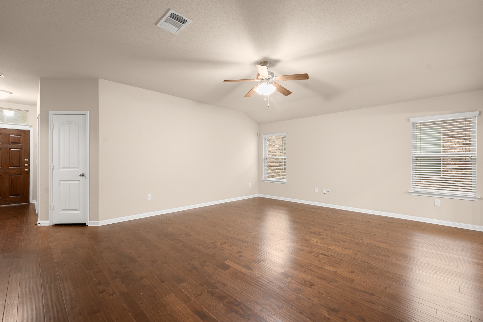 305 Longhorn Cavern Road Leander, TX 78641 - Photo 7 of 21 One last look at this expansive living space! Those beautiful wood floors really tie the whole room together.
