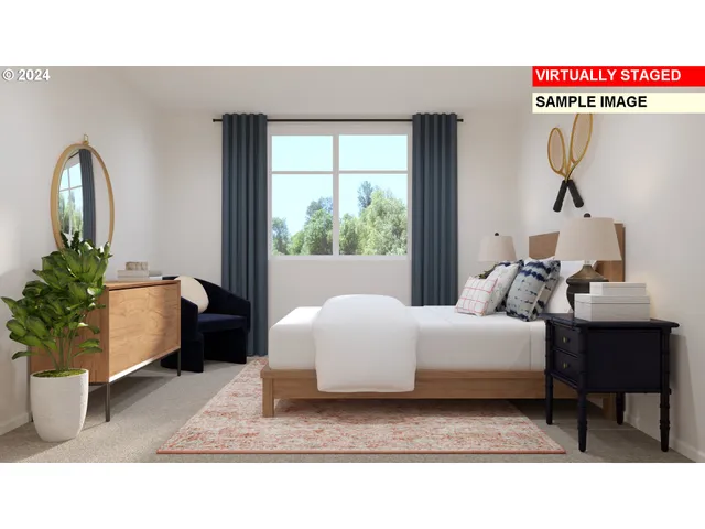 a living room with a couch and a potted plant