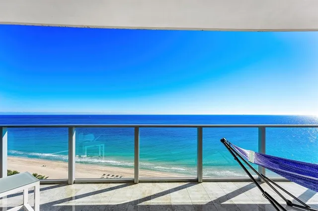 a kitchen with stainless steel appliances kitchen island granite countertop a sink and cabinets