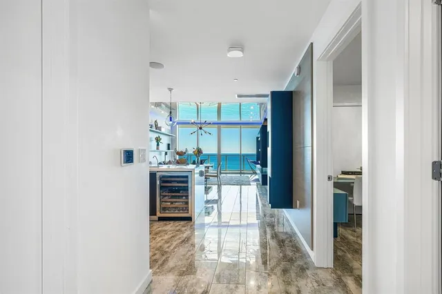 a living room with furniture and a lamp