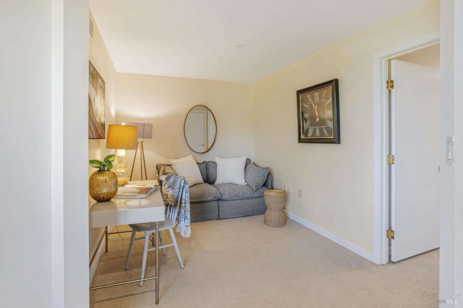 300 Deer Valley Road, Unit 3P San Rafael, CA 94903 - Photo 11 of 23 a living room with furniture a lamp paintings and a window