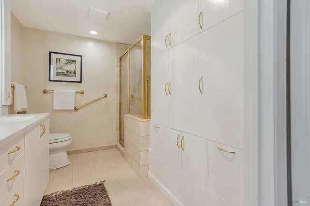a bathroom with a toilet sink and a shower