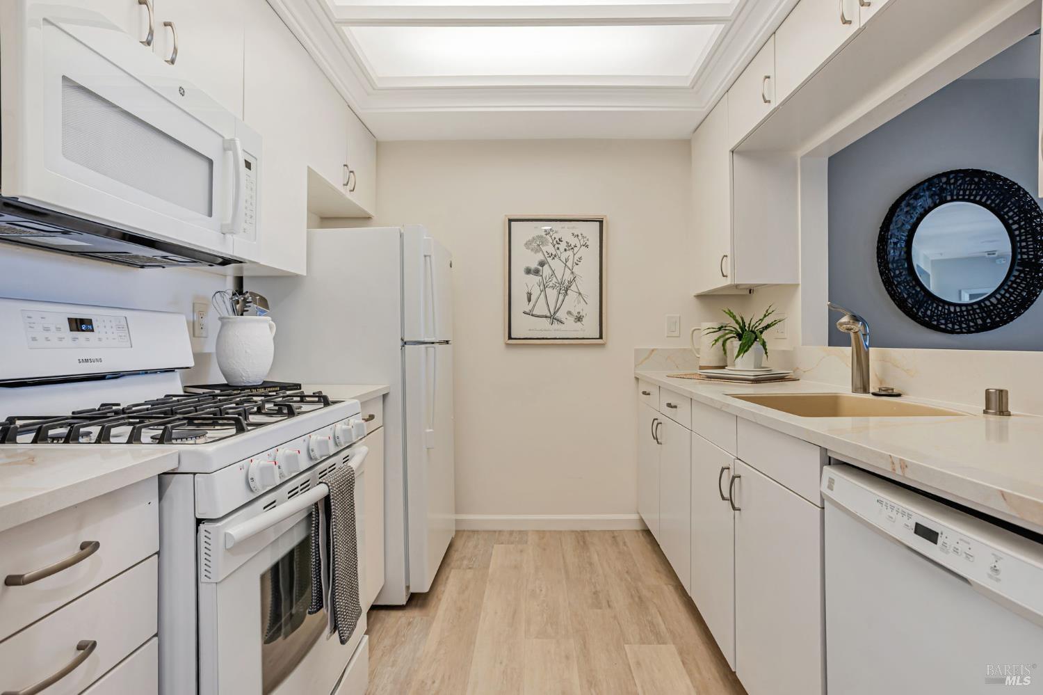 300 Deer Valley Road, Unit 3P San Rafael, CA 94903 - Photo 7 of 23 a kitchen with sink stove and cabinets