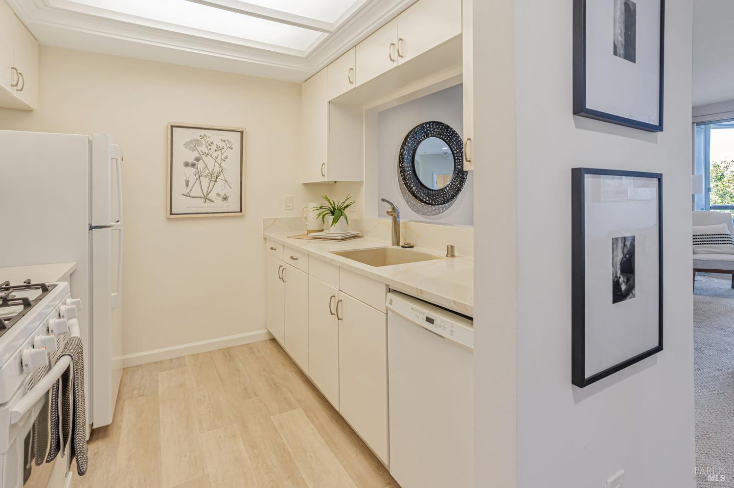 300 Deer Valley Road, Unit 3P San Rafael, CA 94903 - Photo 8 of 23 a bathroom with a sink and a mirror
