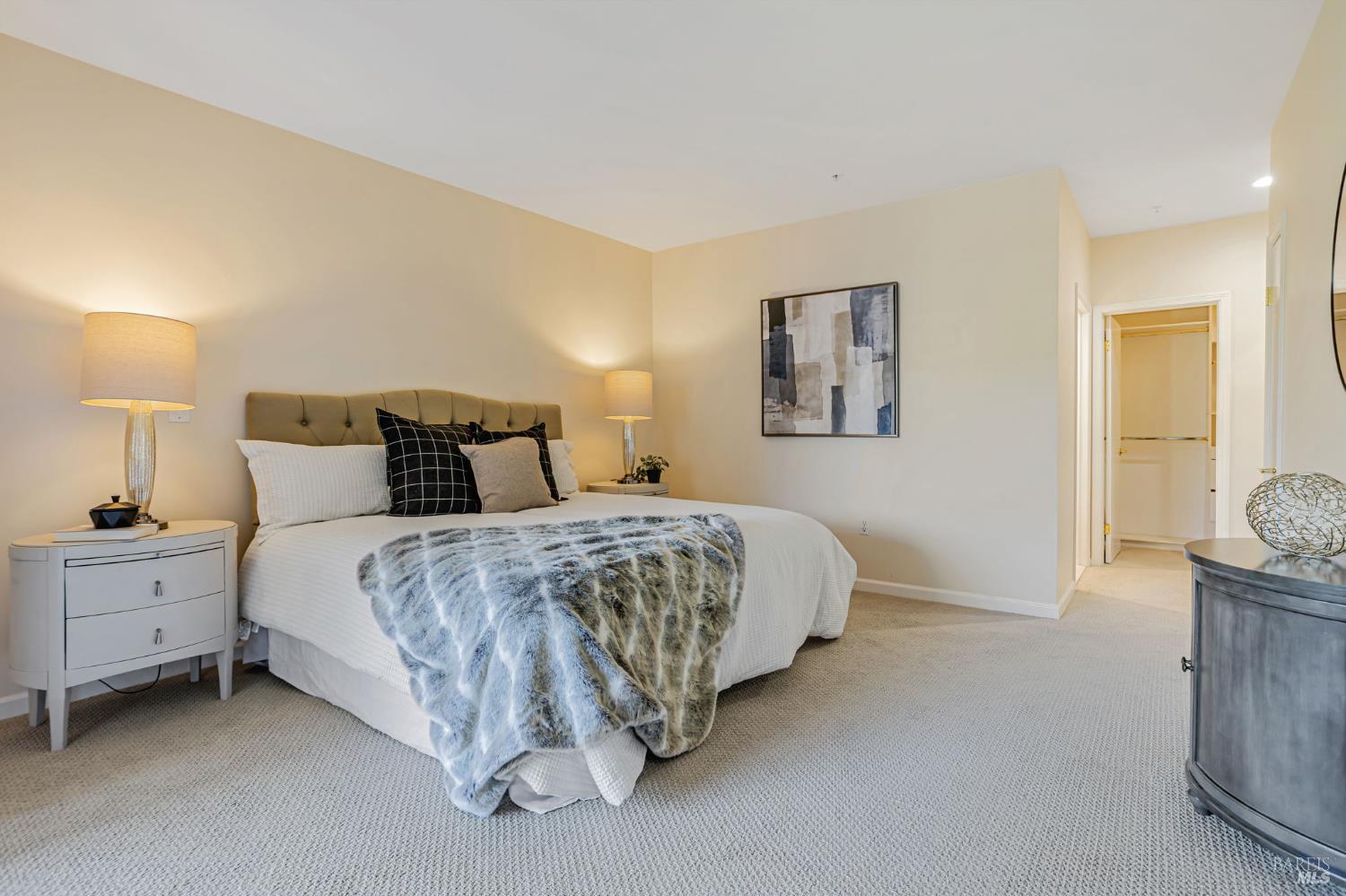 300 Deer Valley Road, Unit 3P San Rafael, CA 94903 - Photo 10 of 23 a bed room with a bed and a night stand