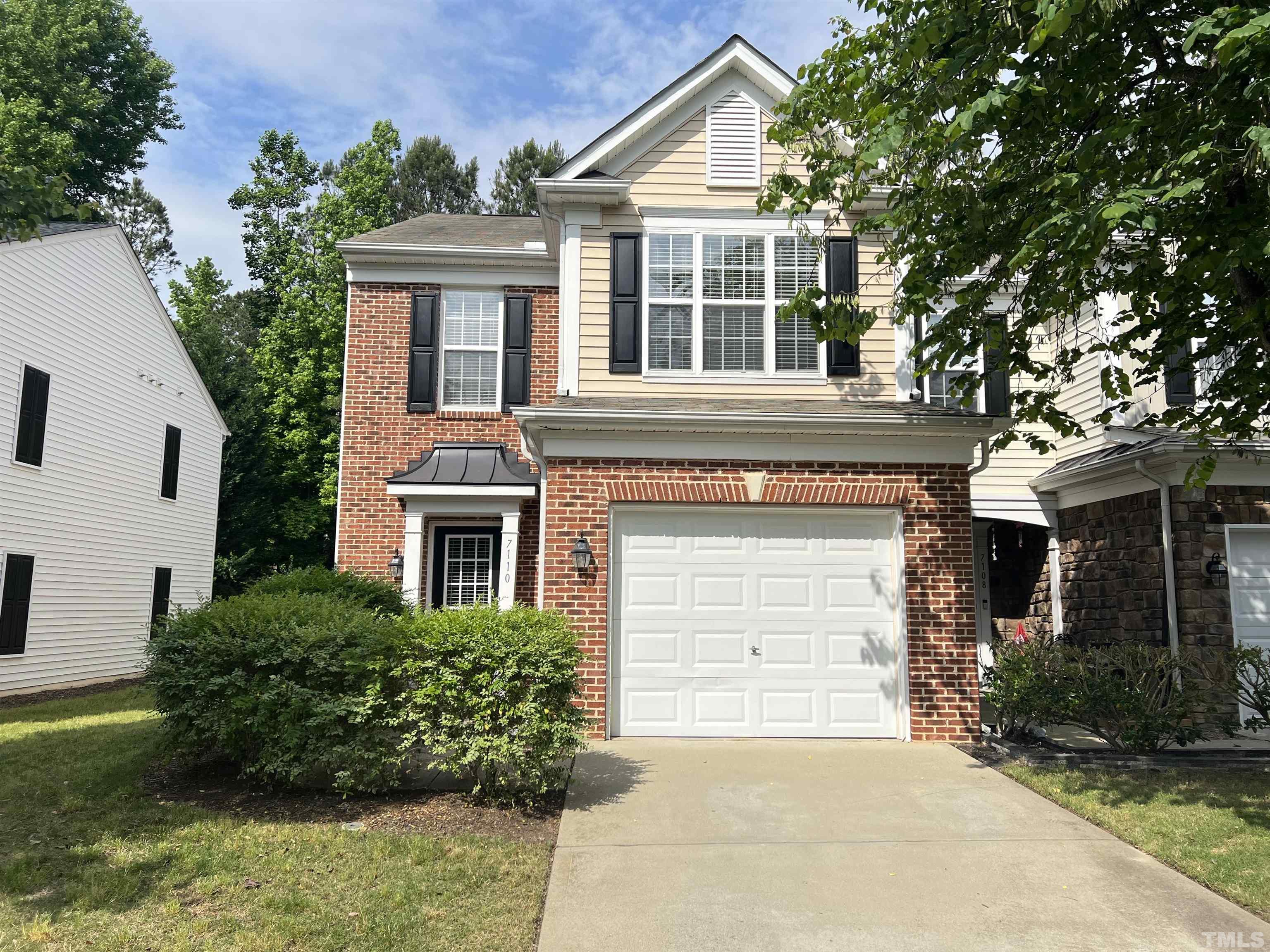 7110 Racine Way Raleigh, NC 27615 - Photo 1 of 19 front view of a house with a yard