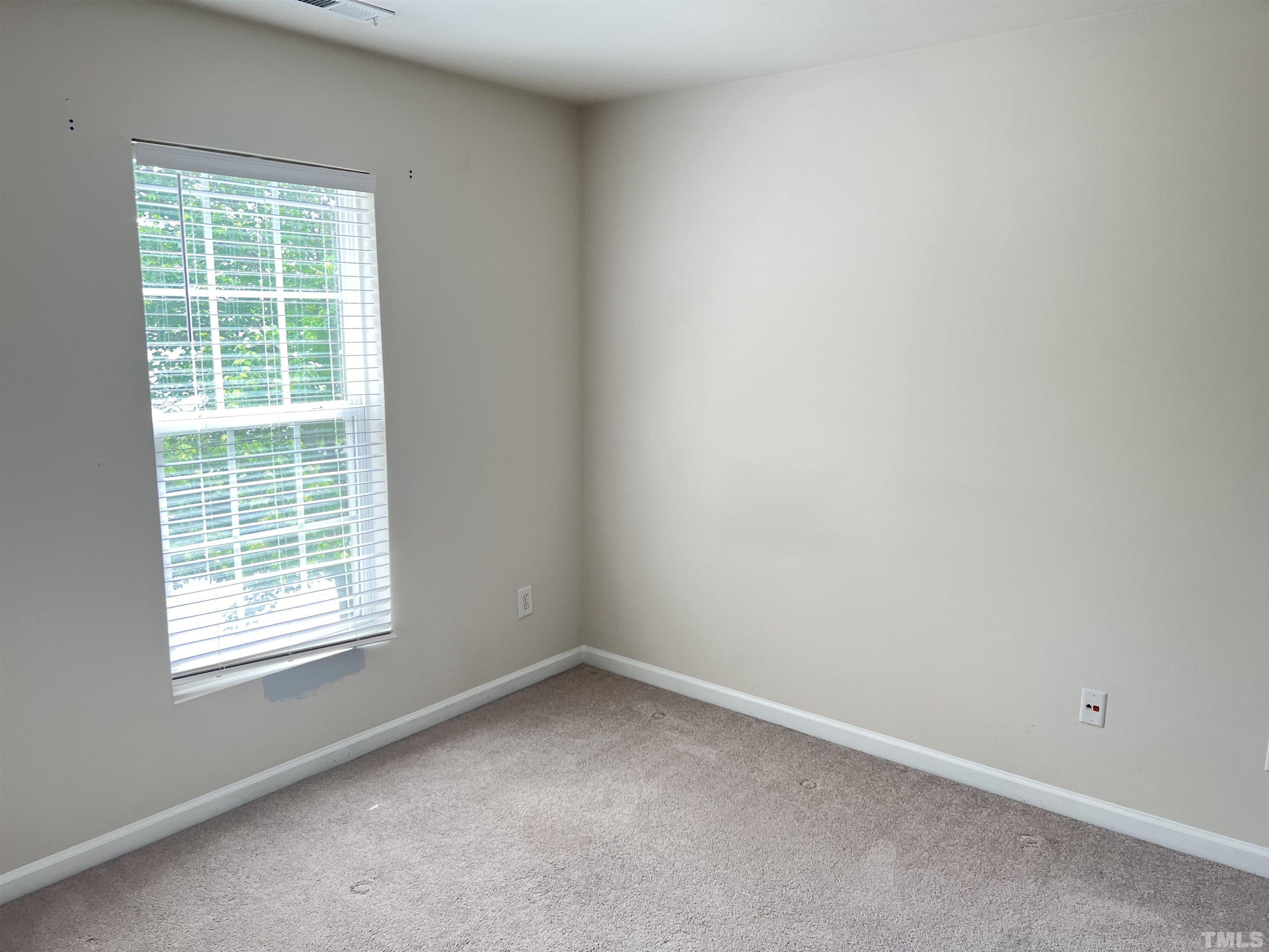7110 Racine Way Raleigh, NC 27615 - Photo 11 of 19 an empty room with a window