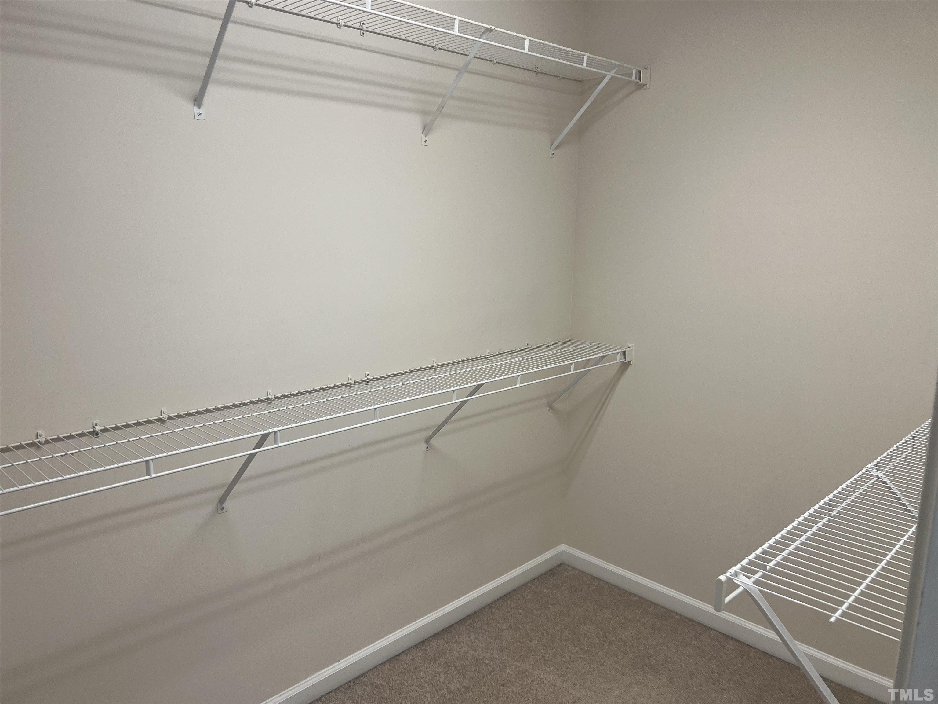 7110 Racine Way Raleigh, NC 27615 - Photo 17 of 19 a view of a room with racks on the wall