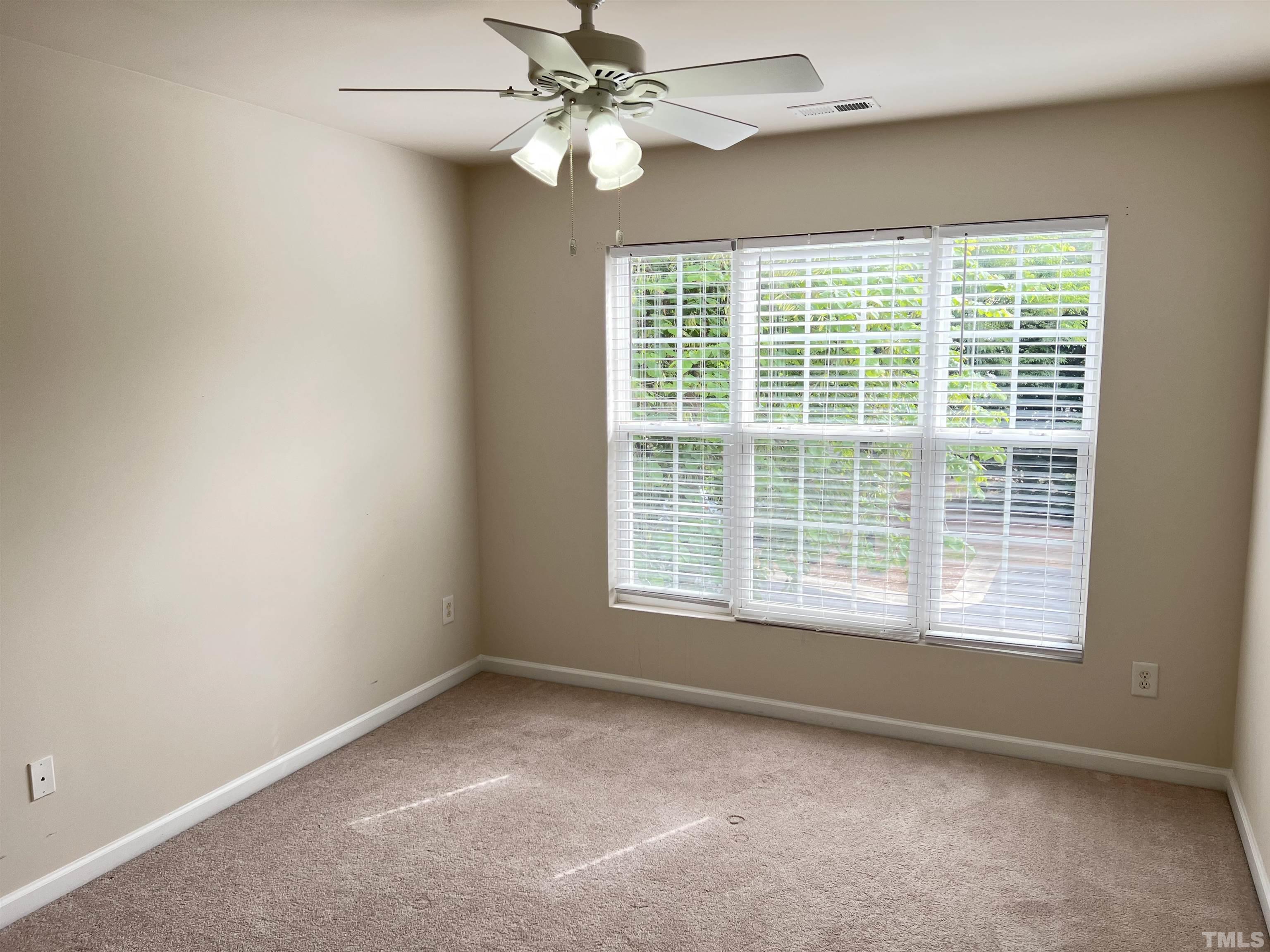 7110 Racine Way Raleigh, NC 27615 - Photo 10 of 19 a view of an empty room with a window