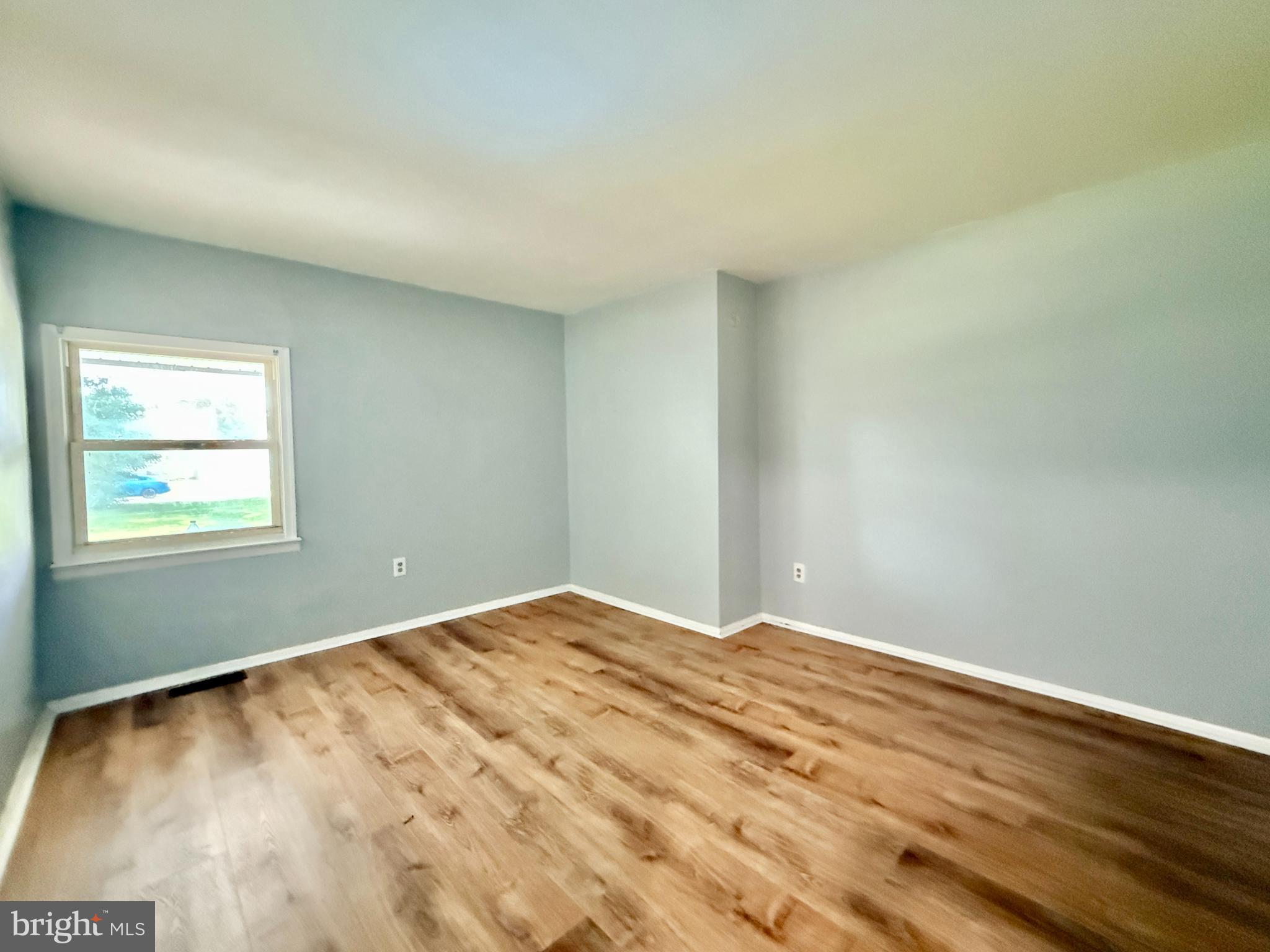 701 Harrison Street Riverside, NJ 08075 - Photo 19 of 26 a view of empty room with wooden floor