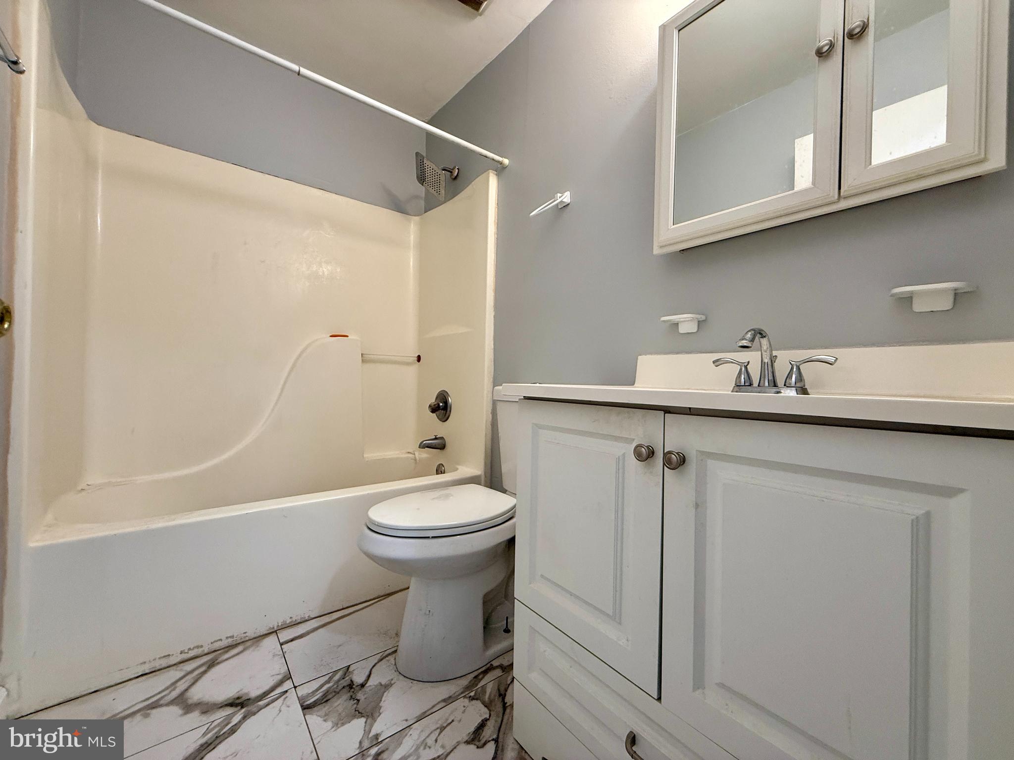 701 Harrison Street Riverside, NJ 08075 - Photo 20 of 26 a bathroom with a sink a toilet and shower