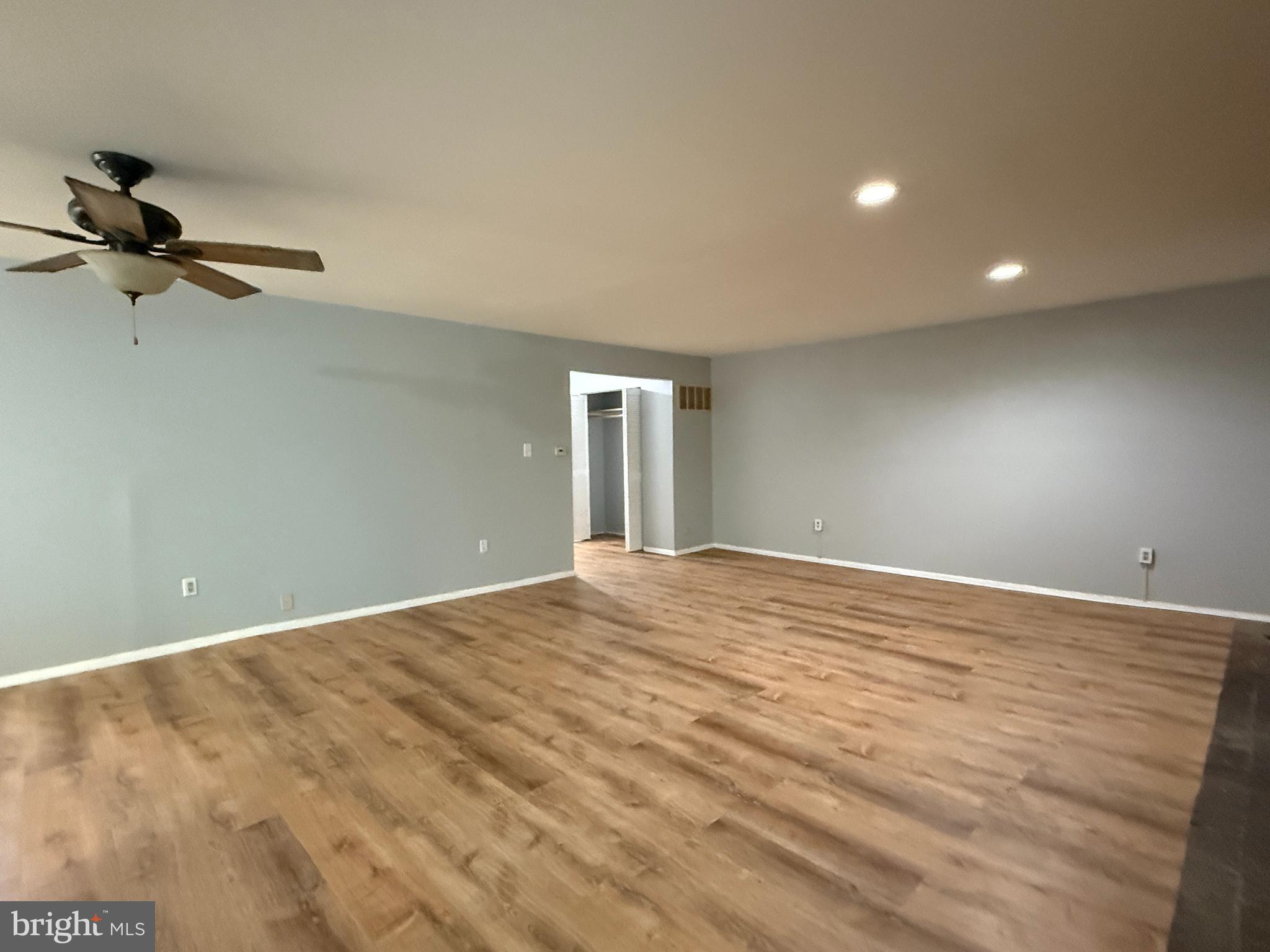 701 Harrison Street Riverside, NJ 08075 - Photo 24 of 26 a view of a big room with wooden floor and windows