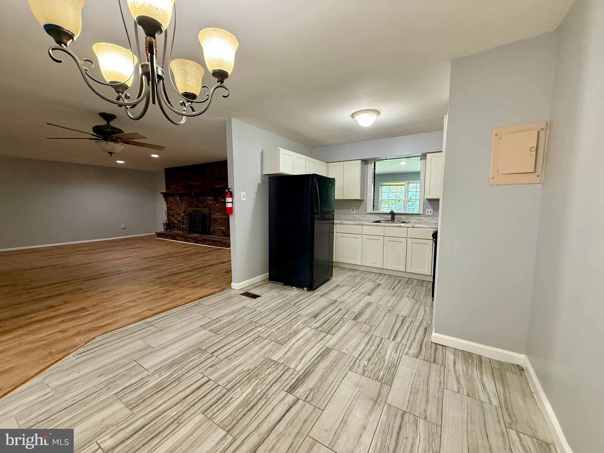 701 Harrison Street Riverside, NJ 08075 - Photo 9 of 26 a view of a livingroom with a fireplace