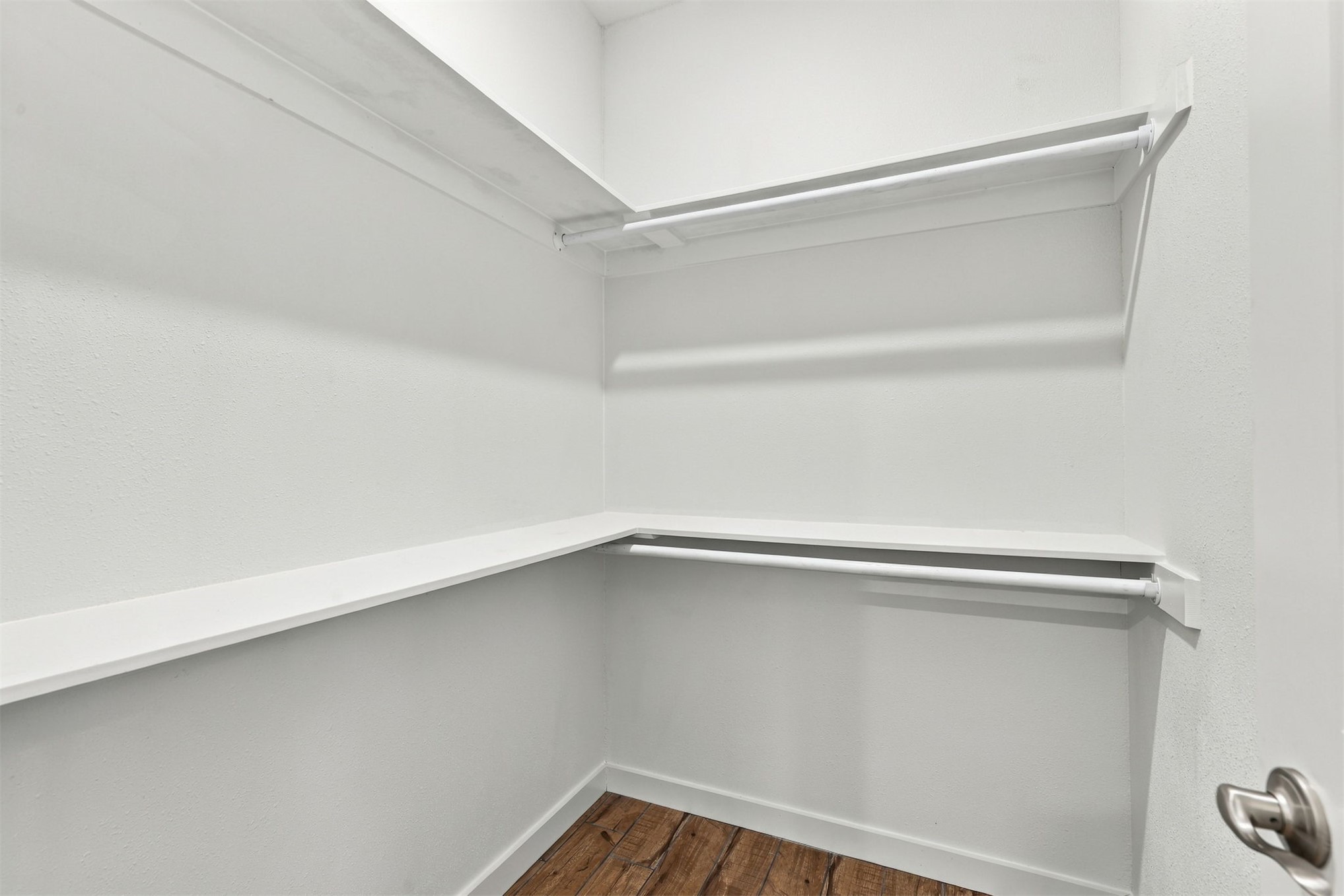 21 Redbird Lane Colbert, OK 74733 - Photo 18 of 27 Built-in shelving and hanging rods with wood-finish flooring