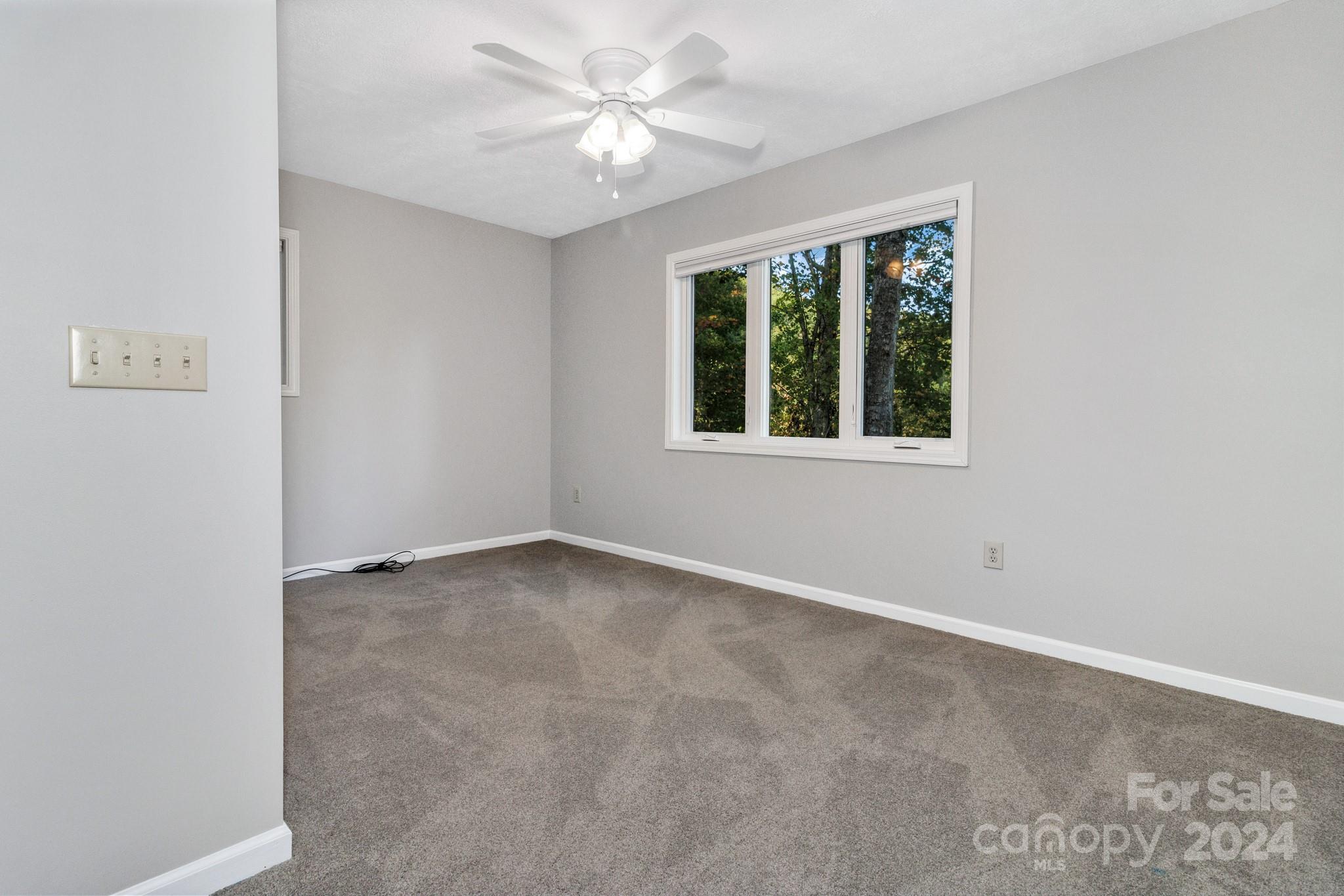 122 Kings Ridge Road Maggie Valley, NC 28751 - Photo 36 of 47 an empty room with a window