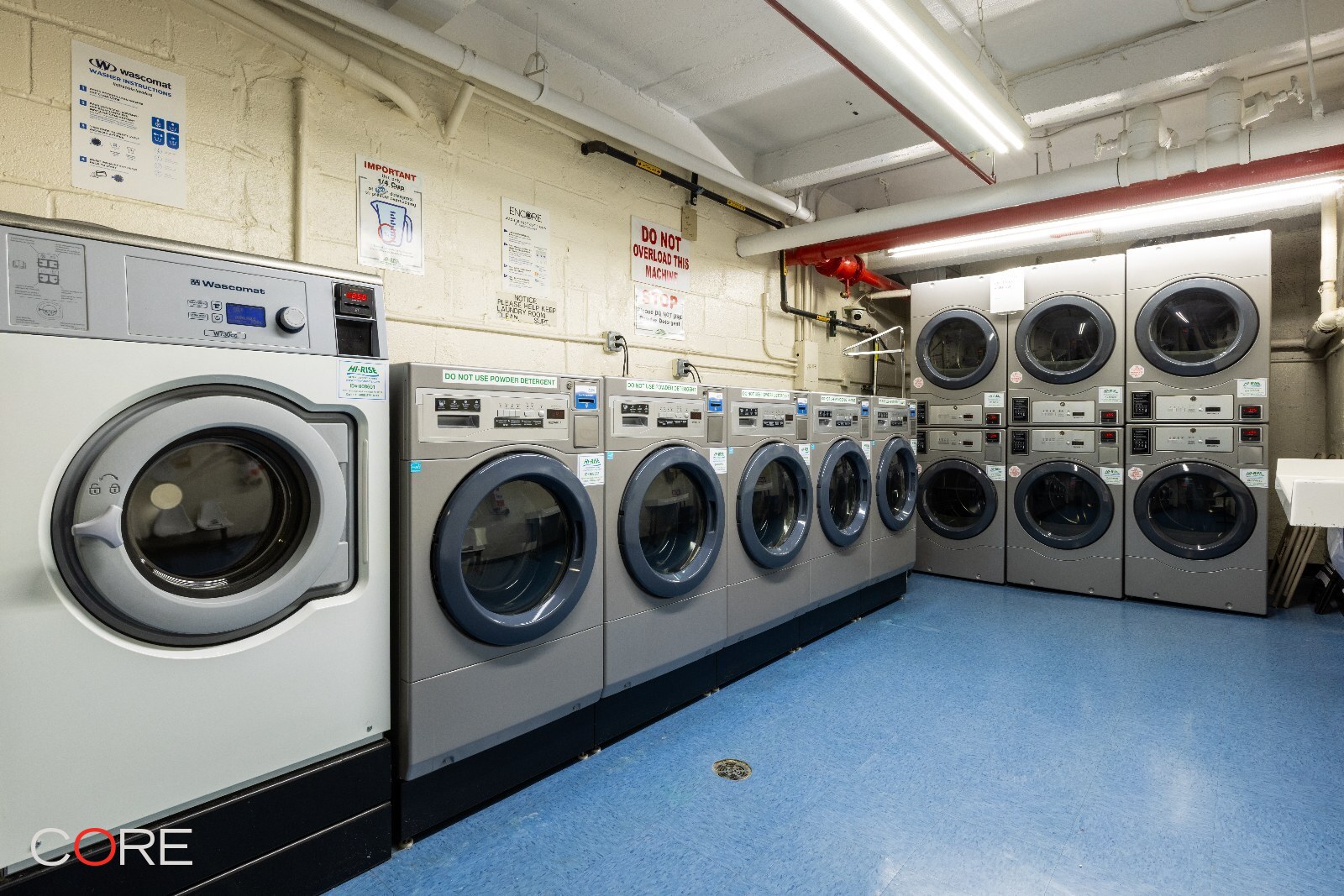 241 East 76th Street, Unit 9I Manhattan, NY 10021 - Photo 10 of 13 a utility room with dryer and washer