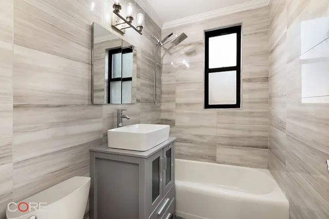 a bathroom with a sink a toilet and bathtub