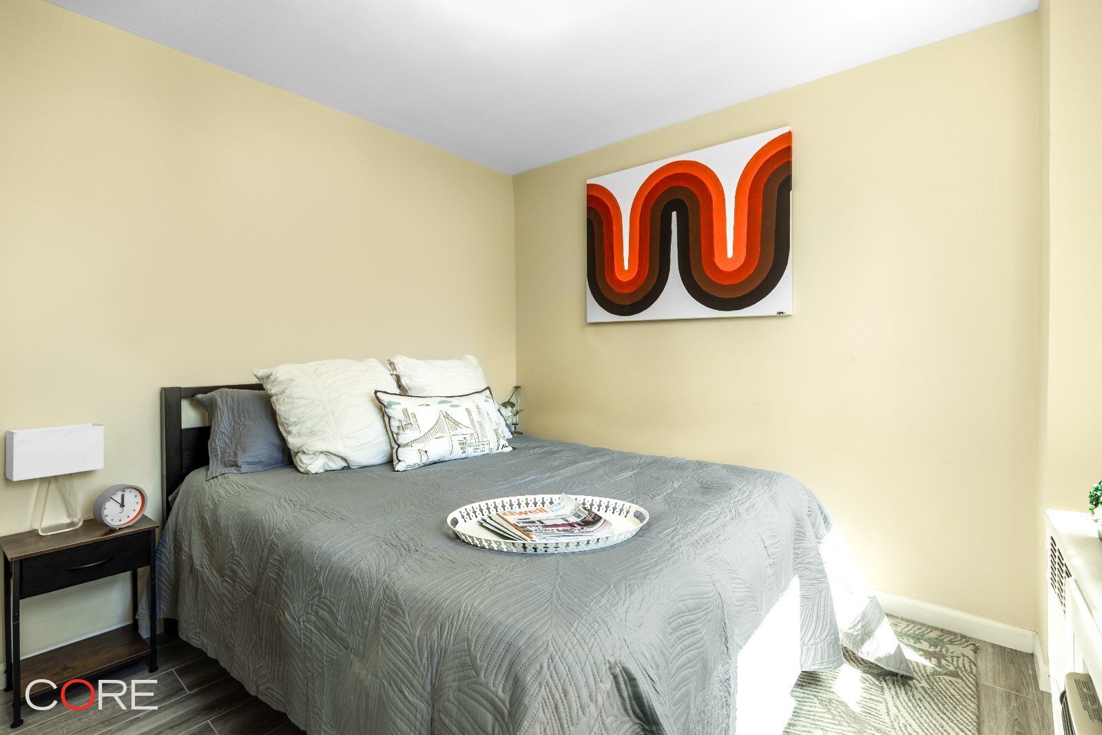 241 East 76th Street, Unit 9I Manhattan, NY 10021 - Photo 7 of 13 a bedroom with a bed and a wall painting