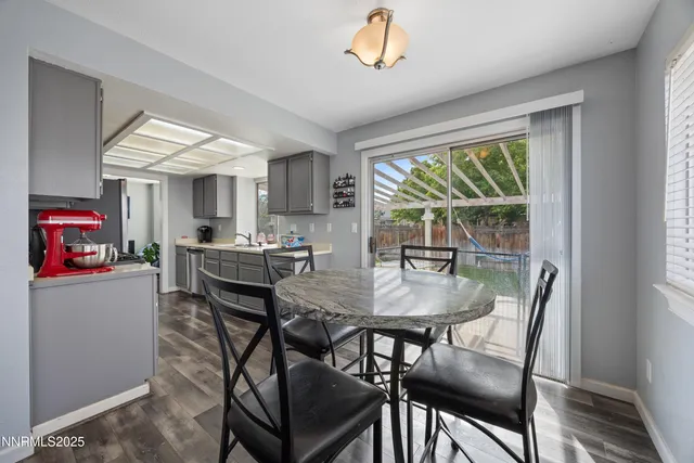 a view of a dining room with furniture window and outside view