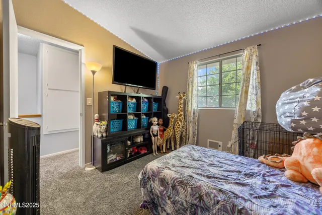 a room with furniture and a flat screen tv