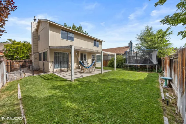 a view of a backyard of the house