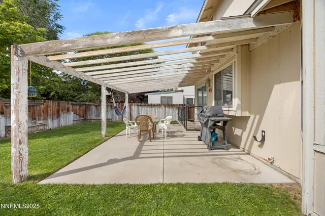 a view of a lush green hillside and houses